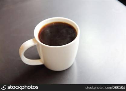 Black coffee on wood background in coffee shop