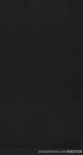Black color paper - vertical. Black colour paper useful as a background - vertical