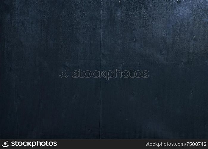 Black color wooden table top view.