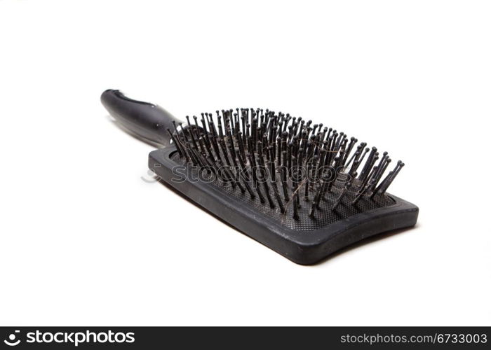 black comb, with remnants of hair