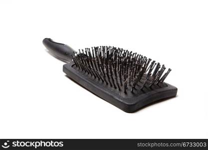 black comb, with remnants of hair