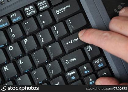 Black computer keyboard with hands