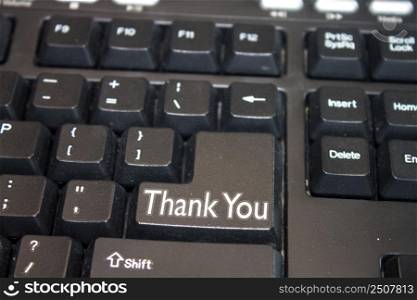 Black Computer Keyboard with Thank You text. Close-up of an electronic Computer Device part, keypad.
