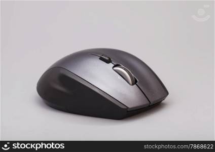 Black computer mouse on gray background