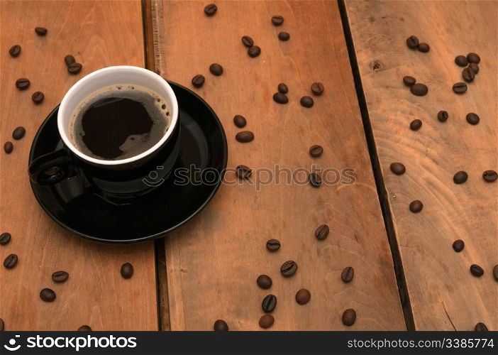 Black Cup of Espresso Coffee on Wooden Table