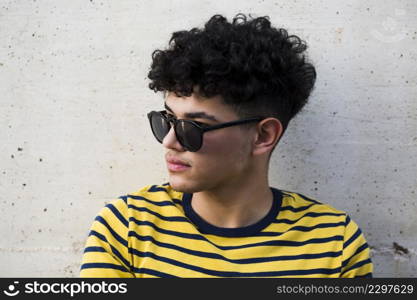 black curly guy sunglusses striped shirt