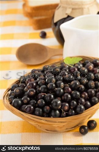 black currants in bowl on table