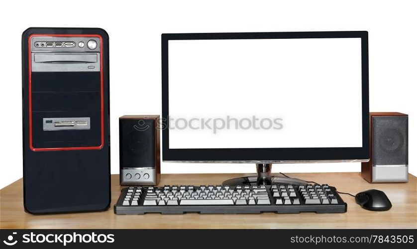 black desktop computer, widescreen display with cutout screen, keyboard, mouse, speakers on wooden table isolated on white background