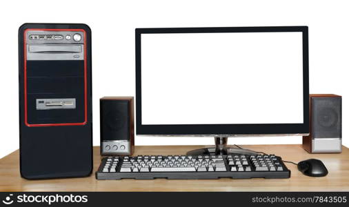 black desktop computer, widescreen display with cutout screen, keyboard, mouse, speakers on wooden table isolated on white background