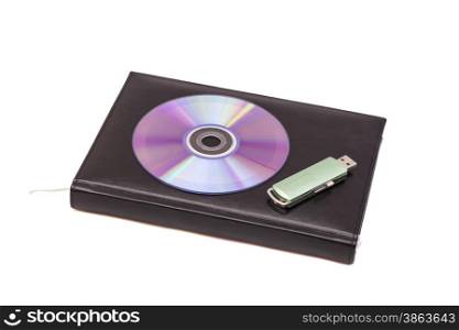 Black diary, flash drive and cd on a white background