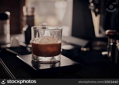black drip coffee in glass cup.selective focus. black drip coffee in glass cup.