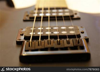 Black electric guitar isolated on the white backgriund