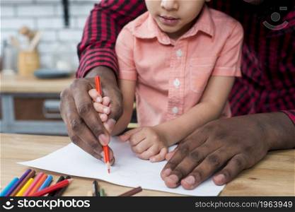 black father son drawing paper. High resolution photo. black father son drawing paper. High quality photo