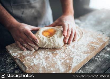 Black female person cooking fried eggs on the kitchen. African woman preparing breakfast at home. Healthy vegetarian lifestyle, vegan food. Black female person cooking fried eggs on kitchen