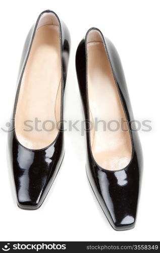 Black feminine varnished loafers on white background