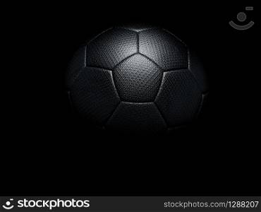 Black football on a matching black background with highlight on the textured surface and copy space