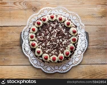 Black Forest cake on rustic wood. Black Forest cake on rustic wood.