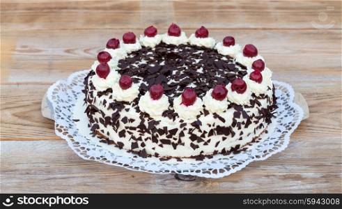 Black Forest cake on rustic wood. Black Forest cake on rustic wood.