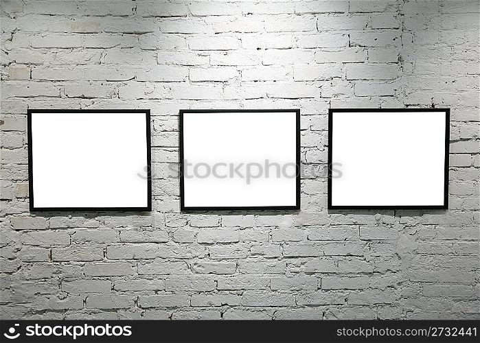 black frames on white brick wall 2