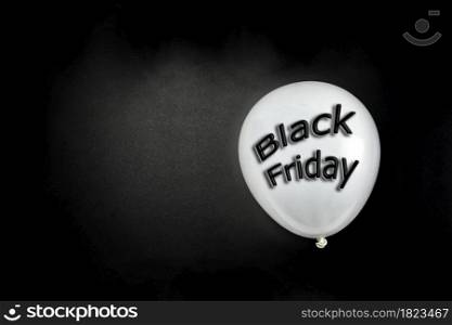Black Friday concept. Quote Black Friday on black balloon. Flat lay, top view. Black Friday background with copy space . space for text. Black Friday concept. Quote Black Friday on black balloon. Flat lay, top view. Black Friday background with copy space .