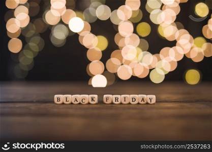 black friday inscription small cubes with bokeh