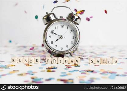 black friday sales inscription small cubes with clock