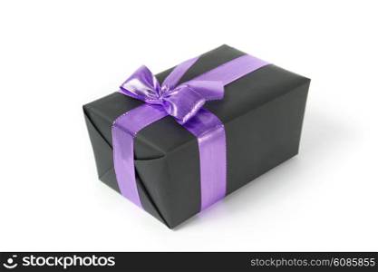black gift box with viloet ribbon on white background