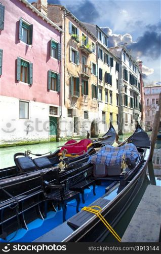 Black gondola in canal Venice in Italy