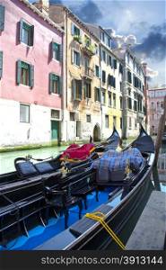 Black gondola in canal Venice in Italy