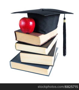 Black graduate hat, stack of big books and red apple, isolated on white background
