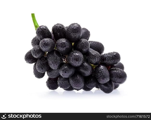Black grapes with drop of water isolated on white background.