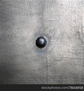 Black grunge metal plate or armour texture with rivet as background