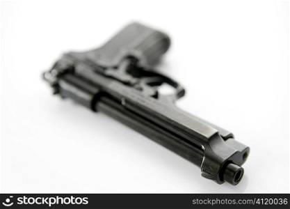 black hand gun pistol over white background