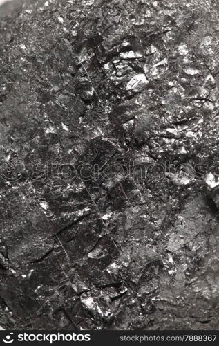 Black hard bituminous coal, carbon nugget closeup macro texture background. Power and energy source.