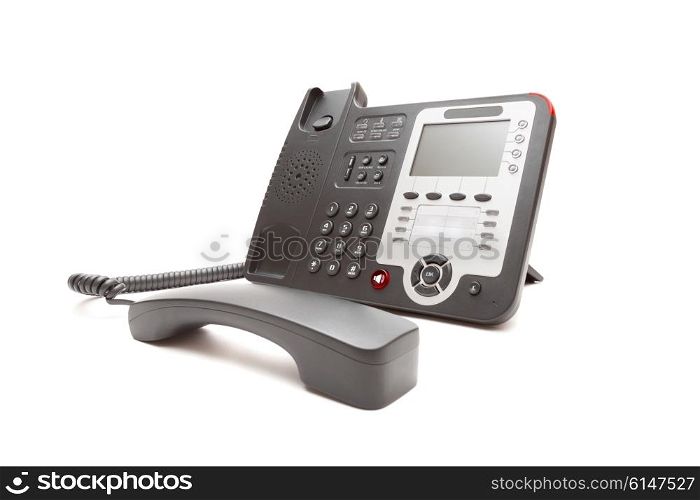 Black IP office phone isolated on white background closeup