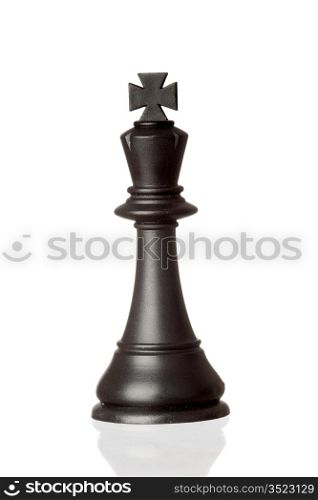 Black king chess piece isolated on white background with reflection on the floor