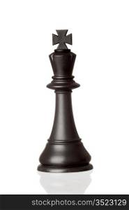 Black king chess piece isolated on white background with reflection on the floor