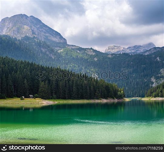 Black lake (Crno jezero) summer landscape. Zabljak Municipality, Montenegro. People unrecognizable.