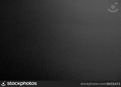Black leather textured background with a lowlight