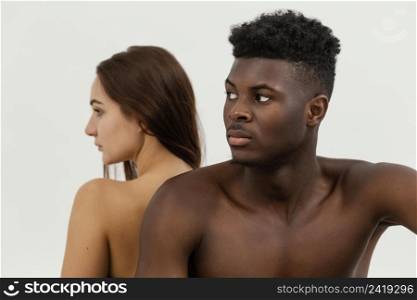 black man white woman posing together
