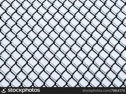 Black medium chain-link fence covered in ice on white background.
