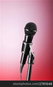 Black microphone against the colorful gradient background