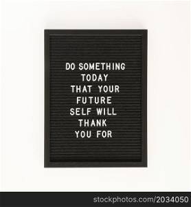 black motivational text board top view