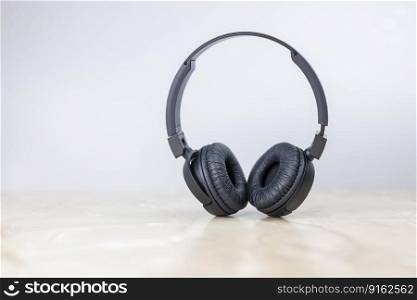 black musical headphones stylish on a gray background