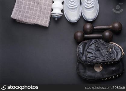 black older punch pads for boxing training with accessories on dark background