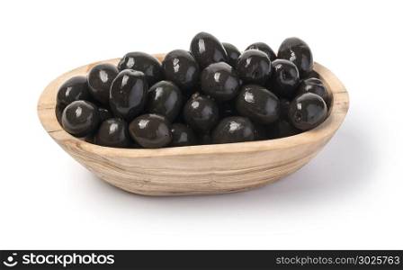 black olives at wooden bowl isolated on white