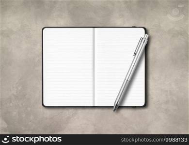 Black open lined notebook mockup with a pen isolated on concrete background. Black open lined notebook with a pen isolated on concrete background