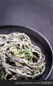 Black pasta with spinach, mascarpone and Parmesan