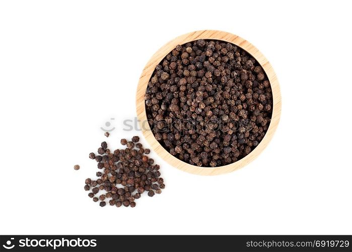 black peppercorns in wooden bowl isolated on white background