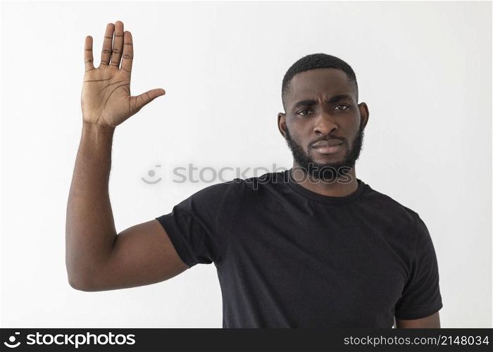 black person waving with his hand